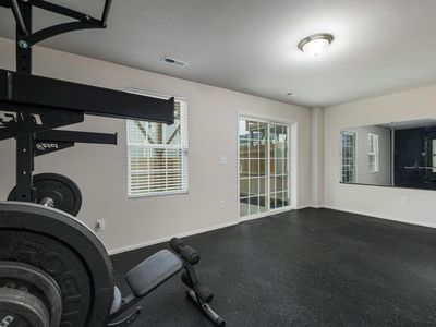 Wide view of a clean minimalist home gym setup